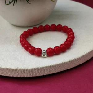 red bracelet with buddha